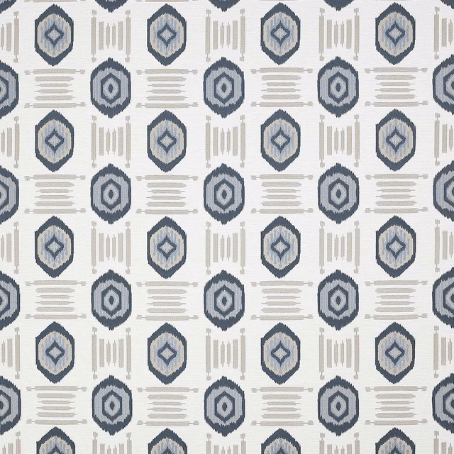Cool slate-blue geometric medallions and linear motifs on an ivory woven ground