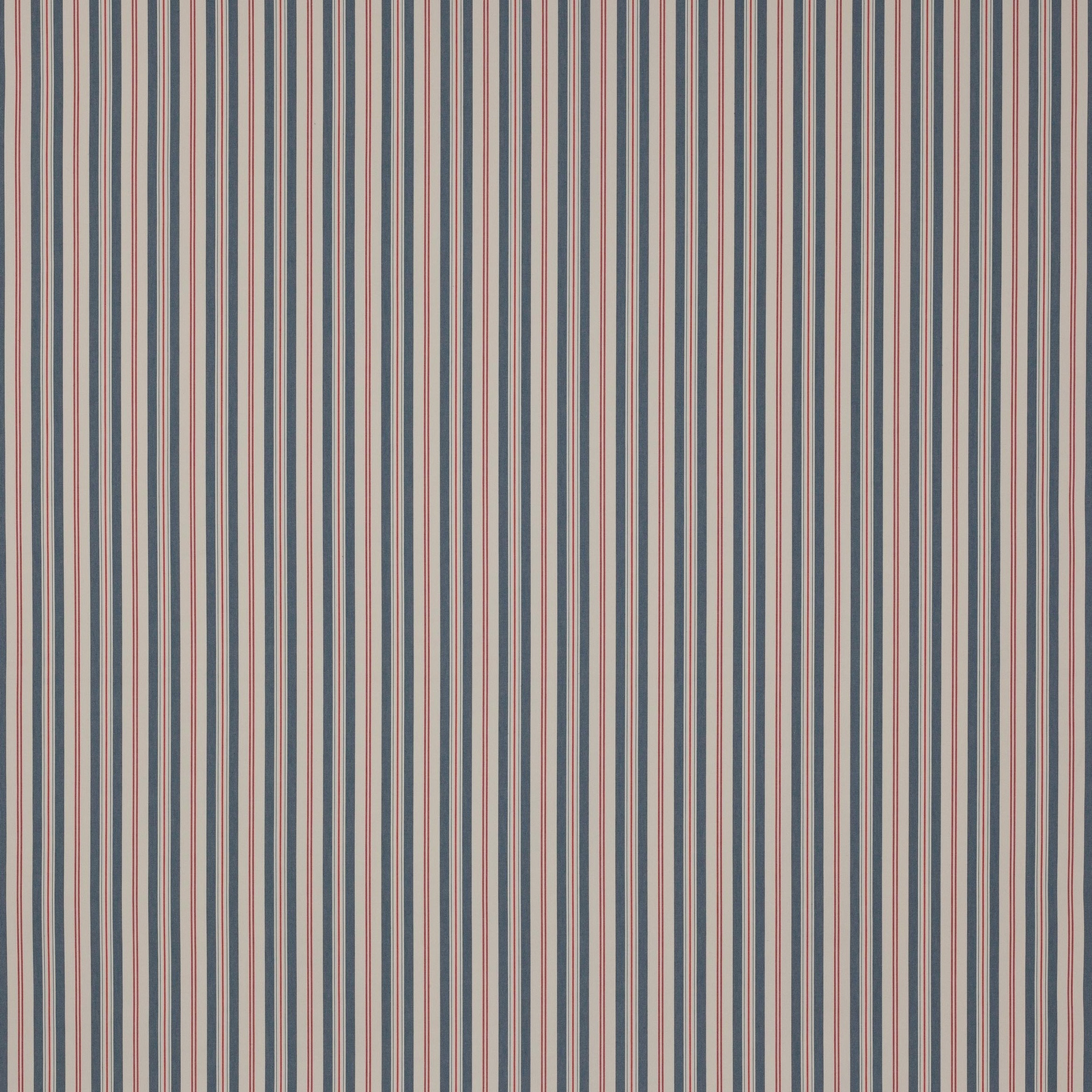 Vertical narrow blue, red and cream stripes on a cotton fabric swatch