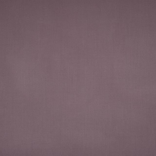 Muted lilac mauve plain wool swatch with a fine matte texture