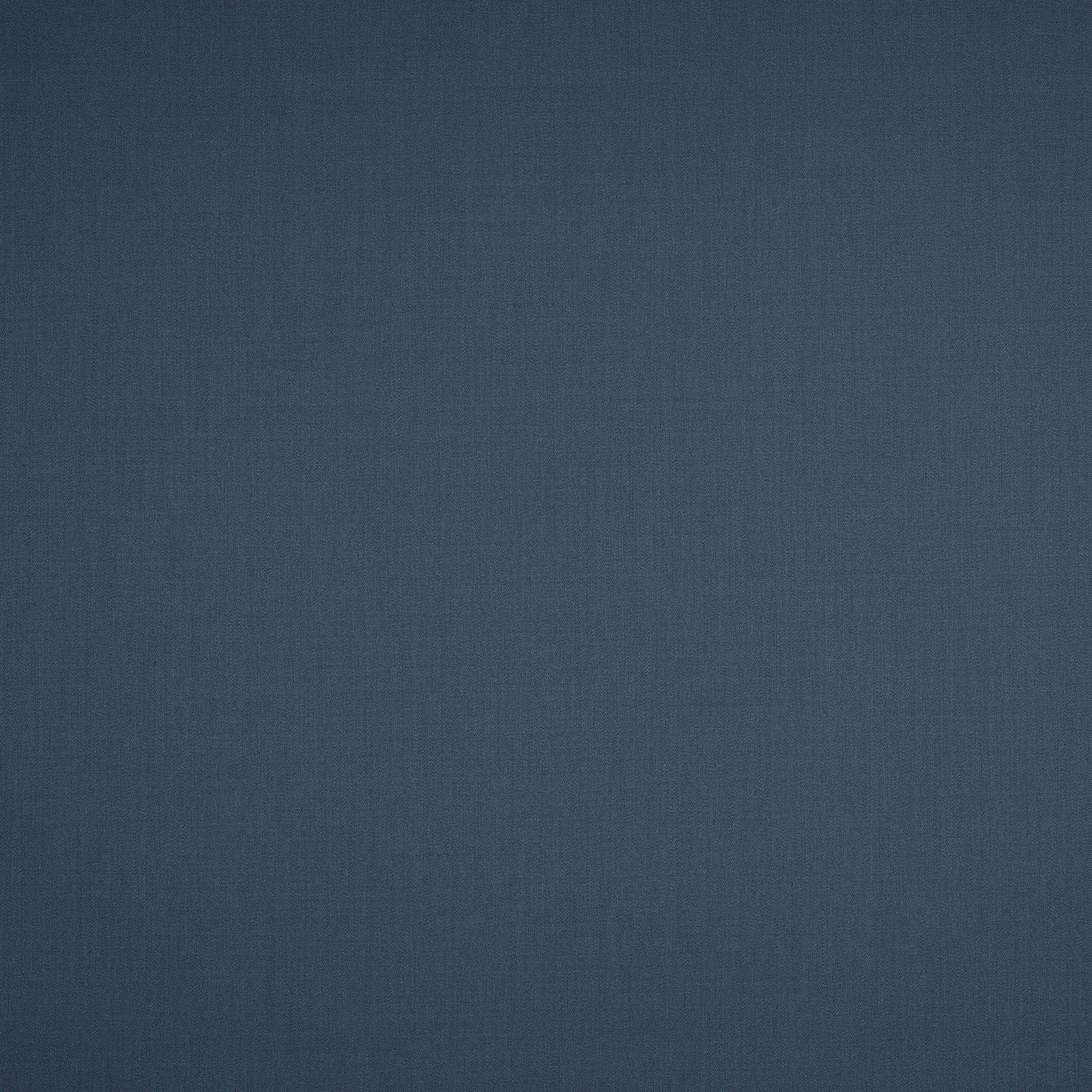 Close-up of deep slate-blue wool fabric with a fine plain weave