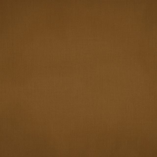Close-up of plain warm nutmeg-brown wool fabric with a fine matte weave