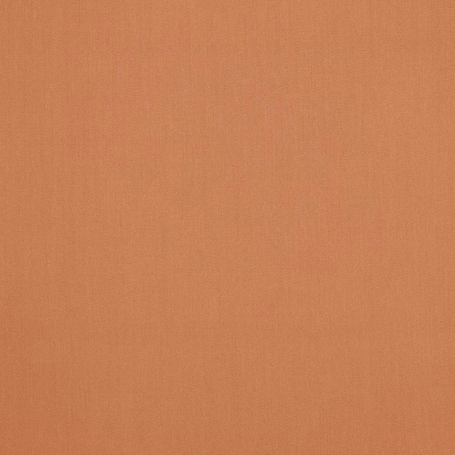 Plain terracotta wool swatch with a soft, matte woven texture