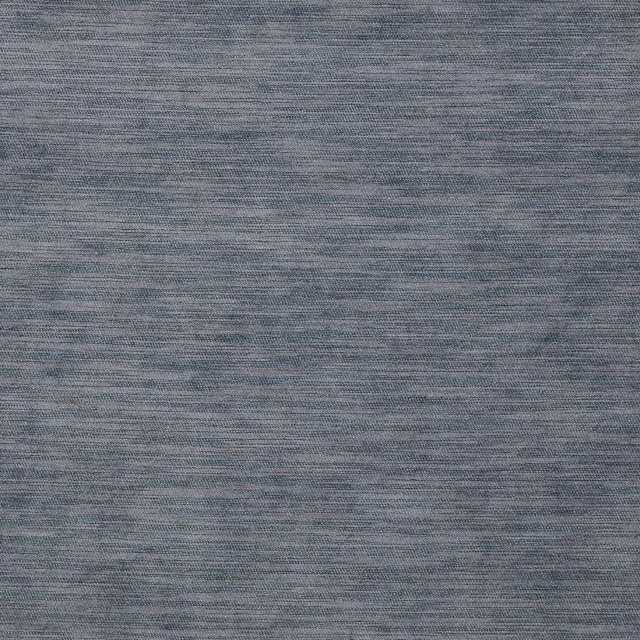 Close-up of a softly mottled slate blue woven fabric with fine texture