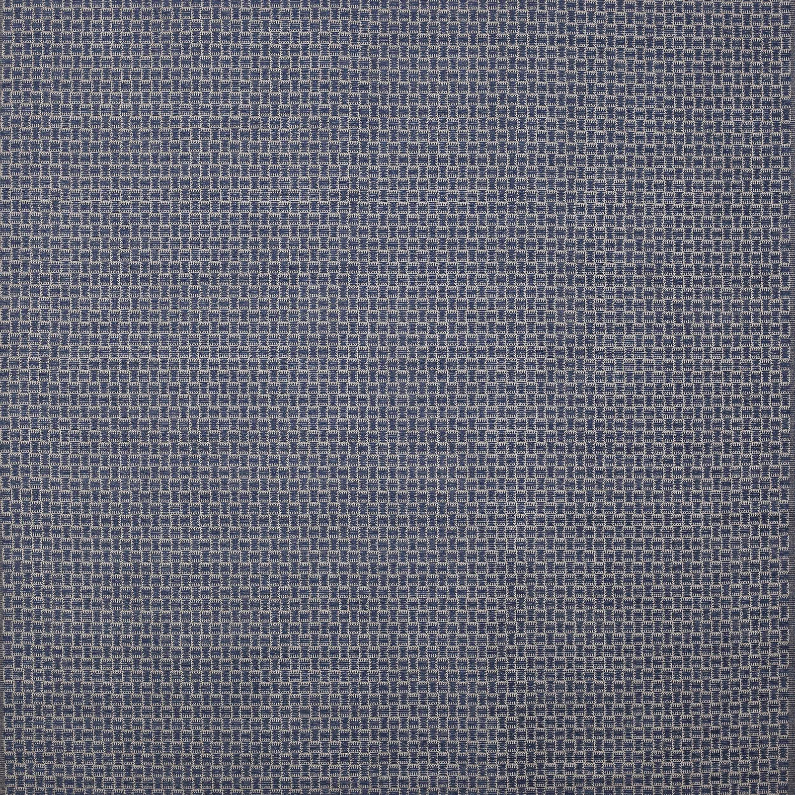 Close-up of a small-scale indigo blue woven fabric with textured grid pattern