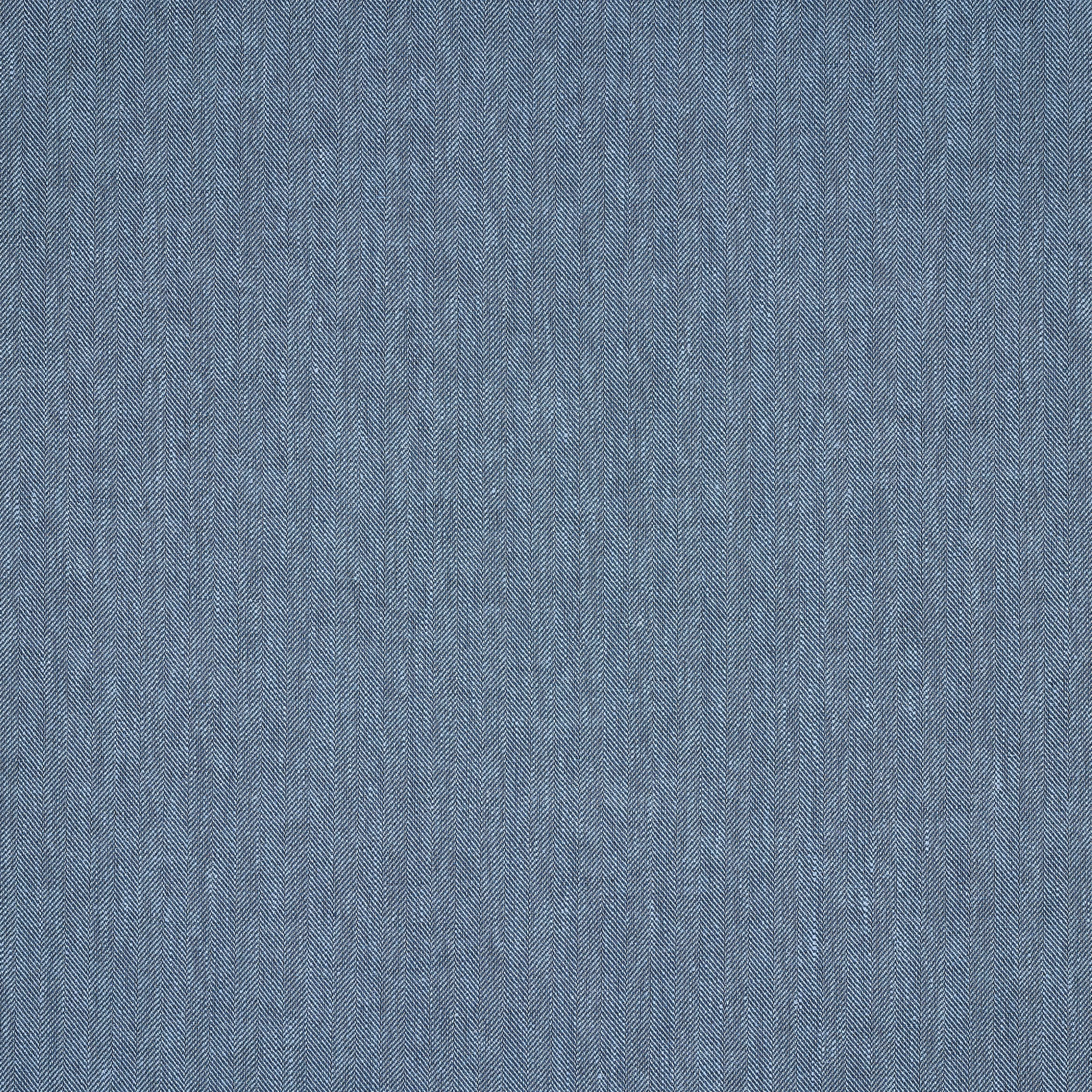 Close-up of soft denim blue linen fabric with fine herringbone texture