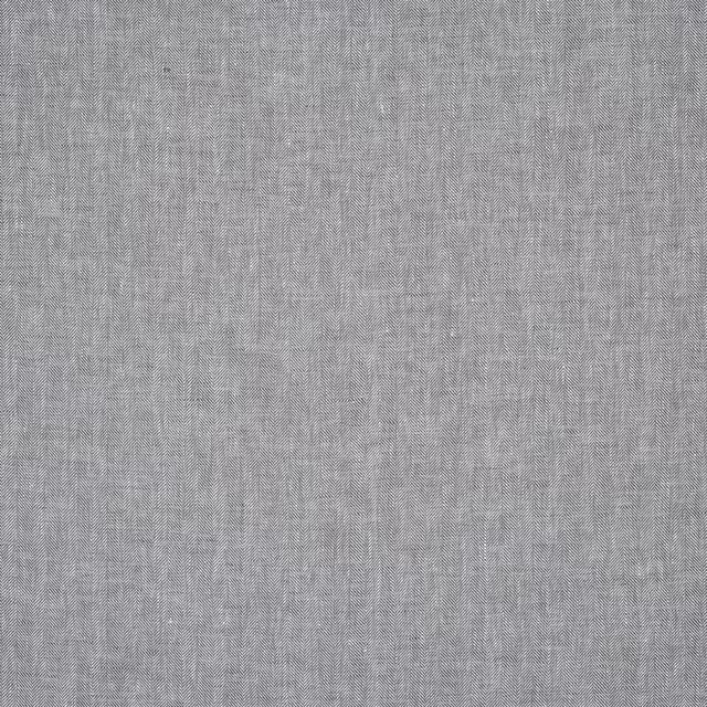Close-up of cool grey linen herringbone fabric with fine woven texture