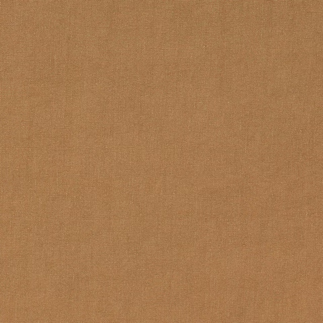 Close-up of warm camel plain-woven linen fabric with a fine slub texture