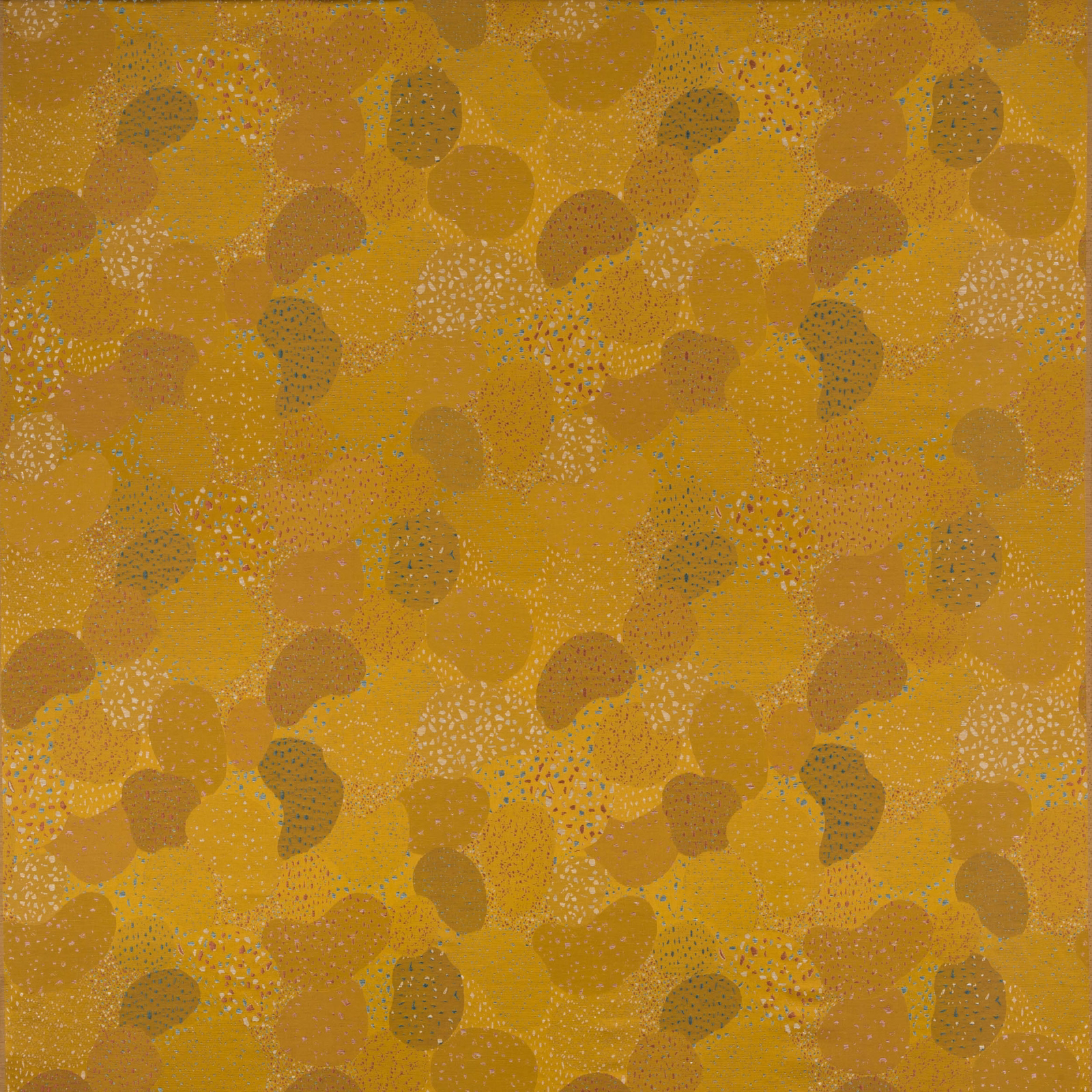Saffron-gold abstract fabric swatch with pebble-like motifs and subtle tonal speckling