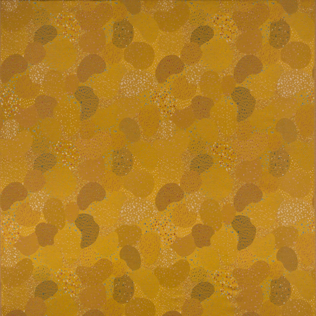 Saffron-gold abstract fabric swatch with pebble-like motifs and subtle tonal speckling