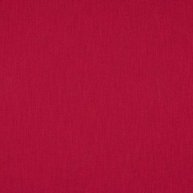 Close-up of rich berry pink plain woven fabric with fine linen texture