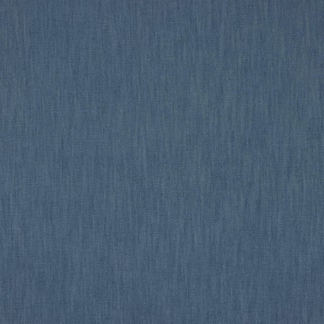 Close-up of muted cobalt blue plain weave fabric with fine textured surface