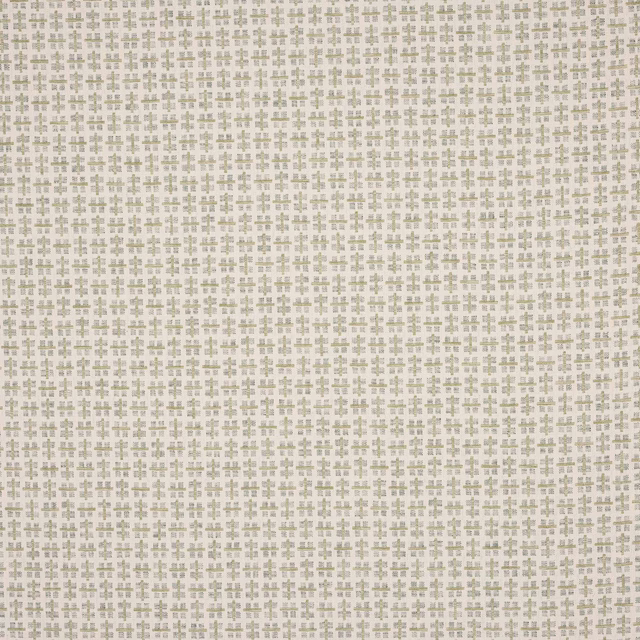 Pale geometric fabric swatch with small sage green motifs on an ivory ground