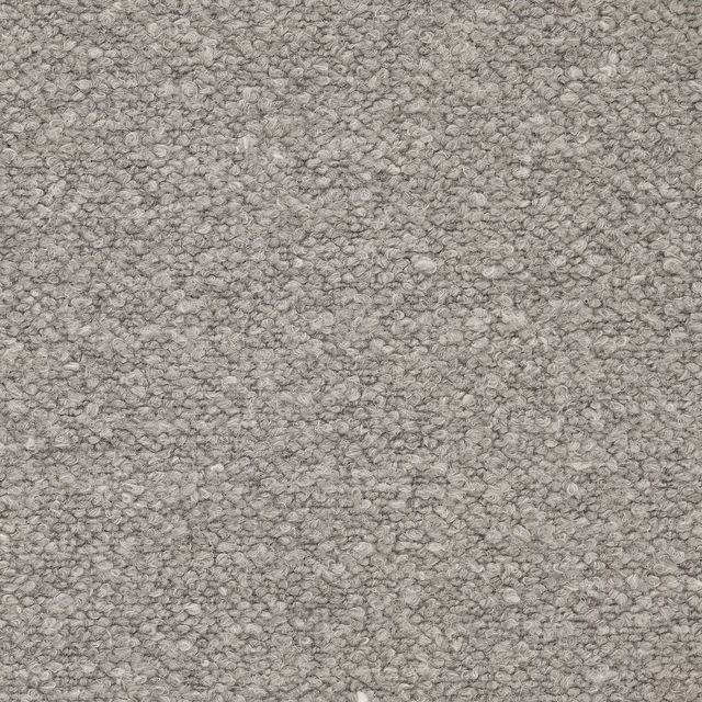Close-up of soft fog-grey bouclé-style fabric with a pebble texture