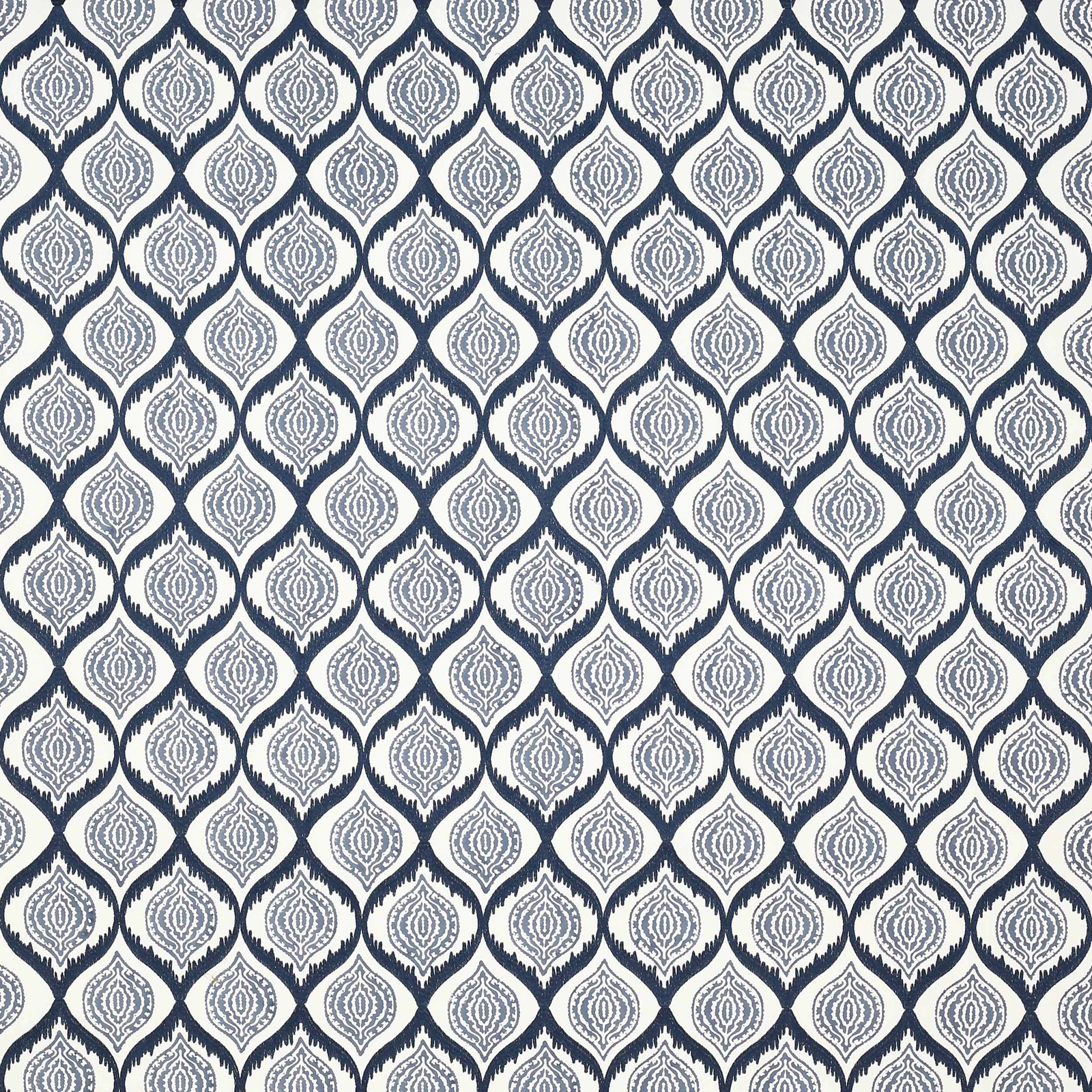 Blue geometric fabric with repeating teardrop medallions on a pale ground
