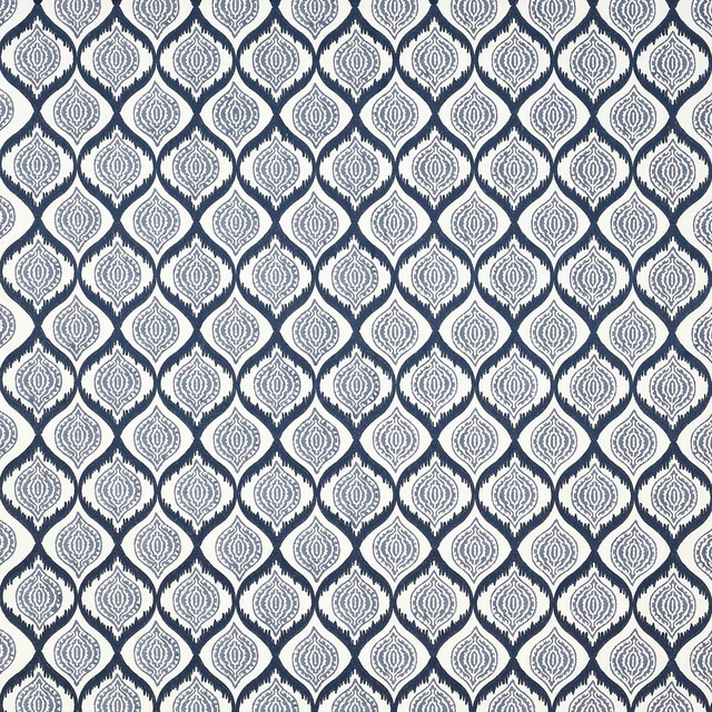 Blue geometric fabric with repeating teardrop medallions on a pale ground