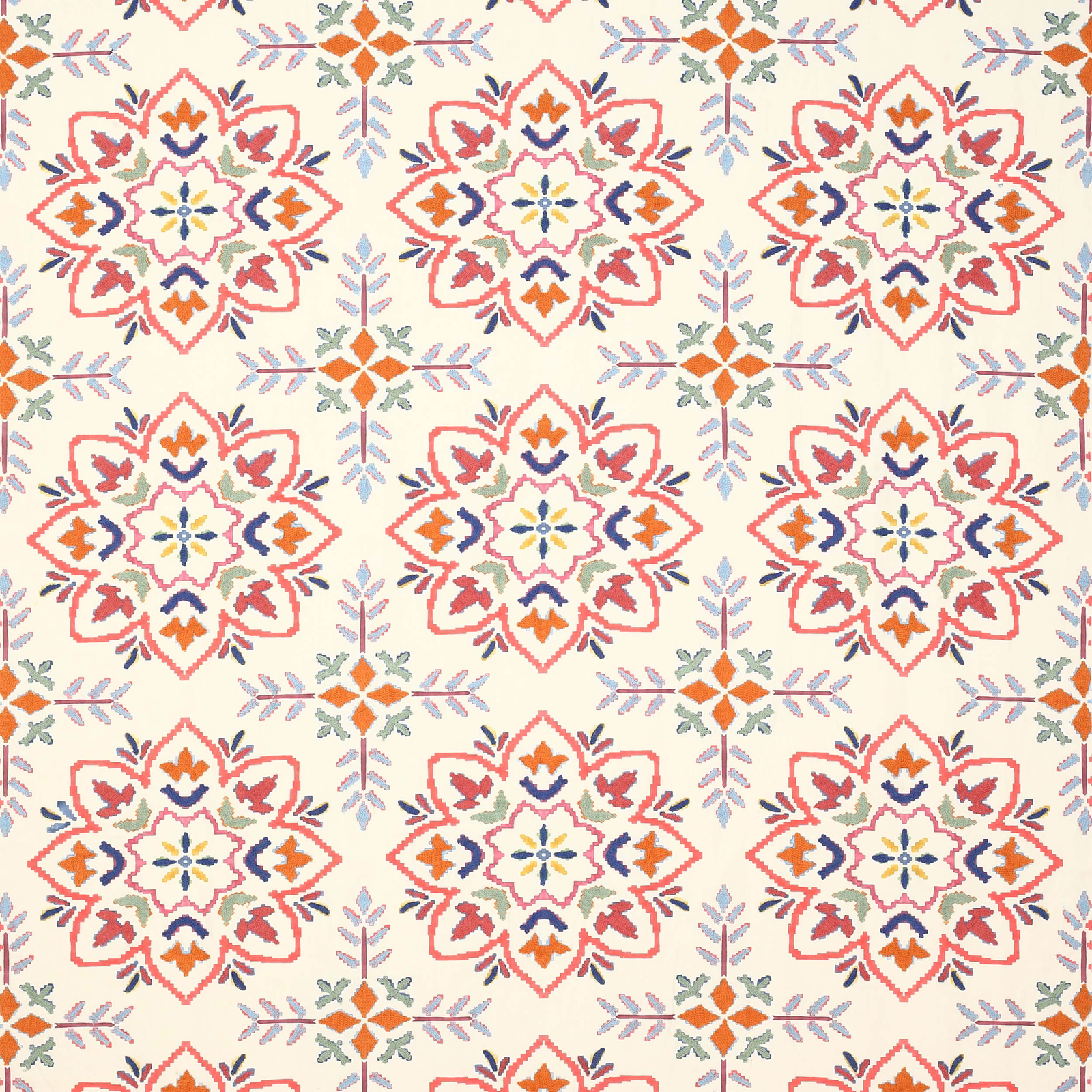 Cream fabric swatch with coral-red medallions and small blue, orange and sage motifs
