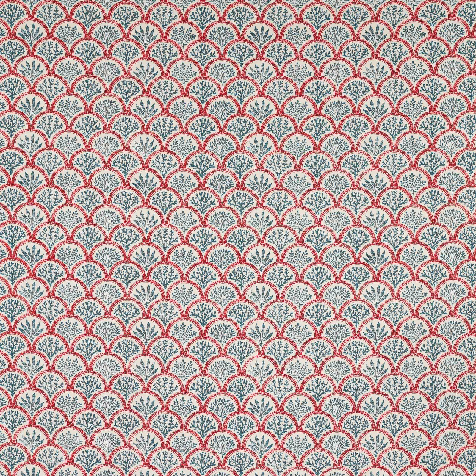 Coral red scallop print with teal botanical motifs on a pale ground