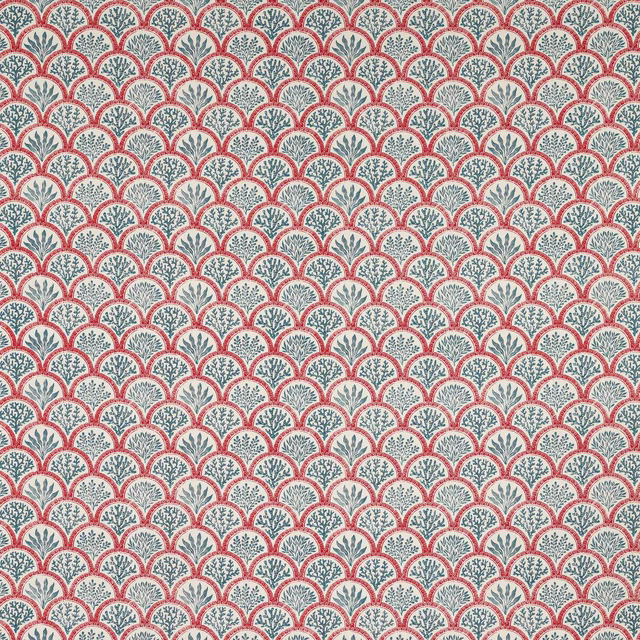 Coral red scallop print with teal botanical motifs on a pale ground