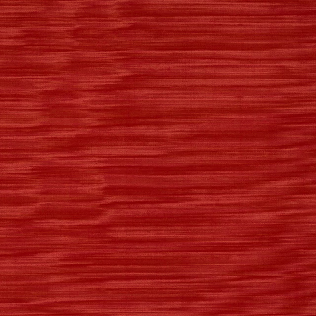 Close-up of a deep coquelicot red woven fabric with fine horizontal texture