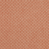 Close-up of a small red and cream geometric woven fabric with textured surface