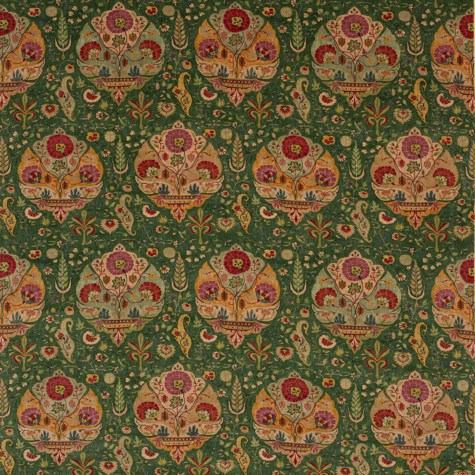 Ornate floral medallion fabric on a deep forest green ground