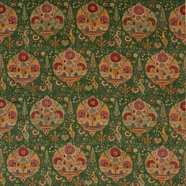 Ornate floral medallion fabric on a deep forest green ground