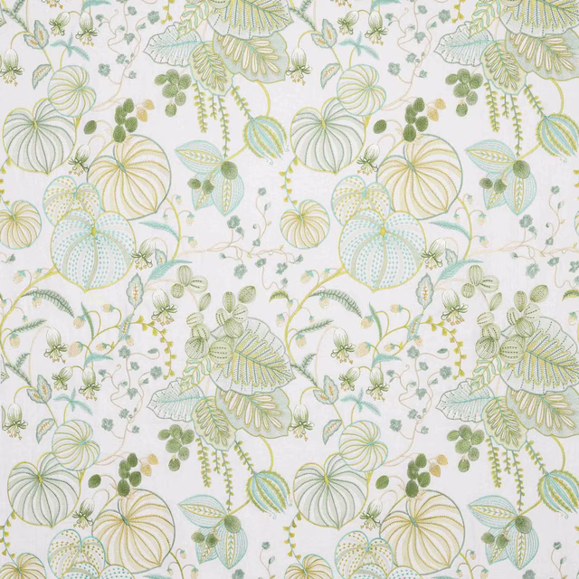 Swatch of botanical fabric with pale celadon and yellow-green leaf motifs on a white ground