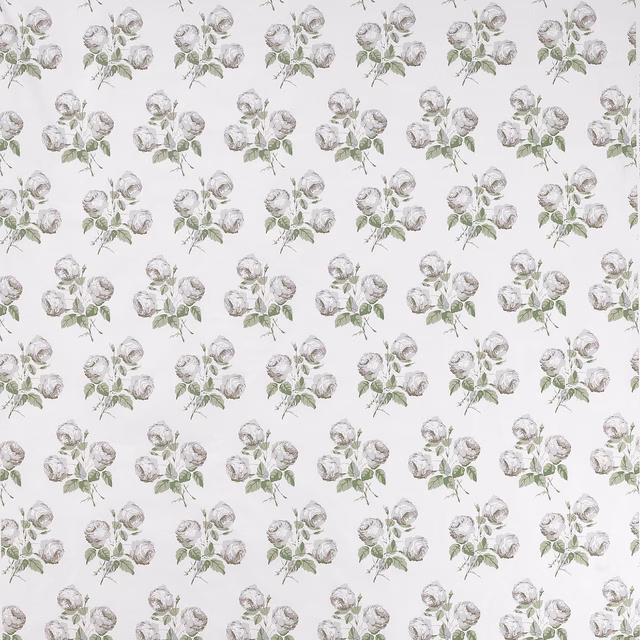 Small pale floral sprigs on a white cotton fabric ground