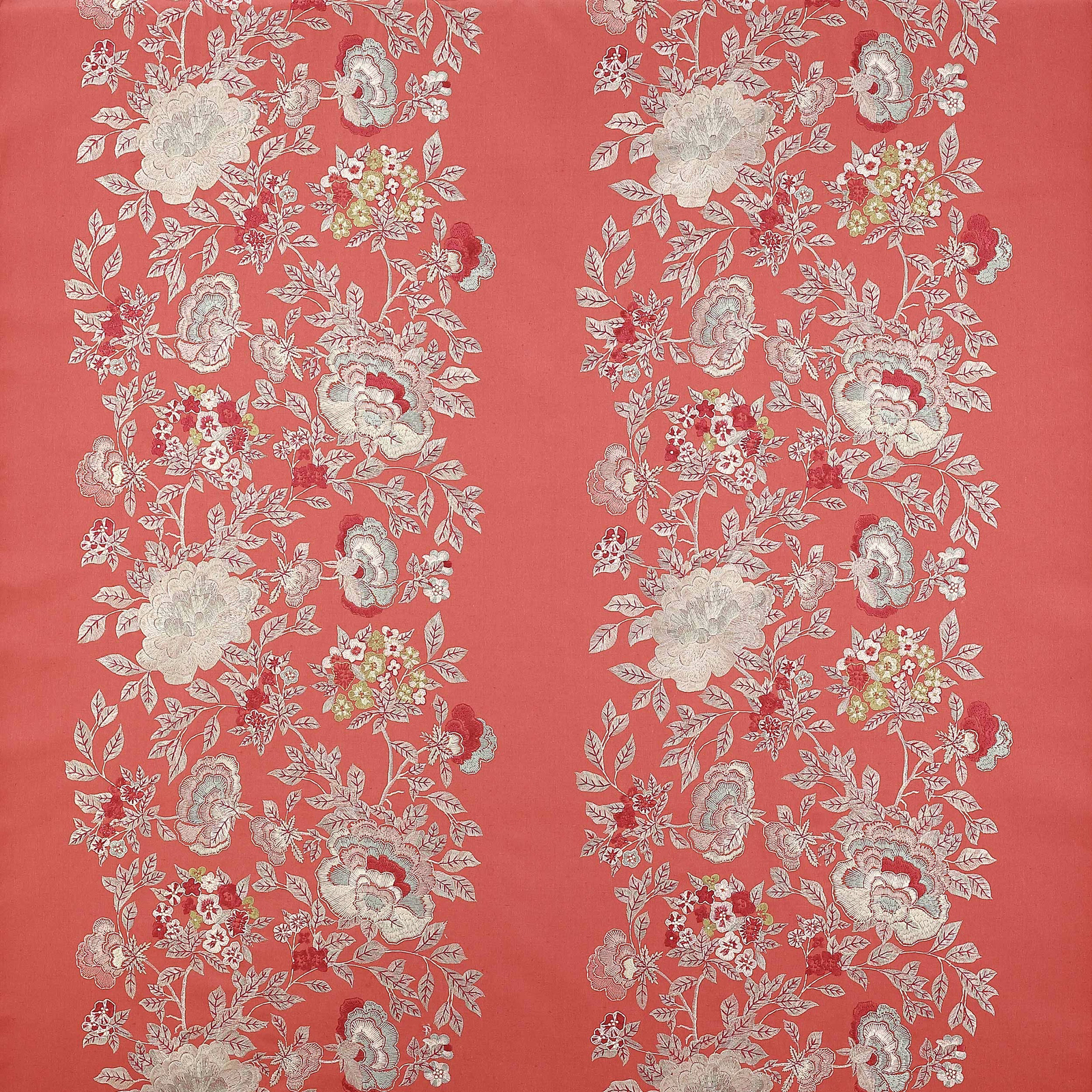 Coral-red floral stripe fabric with pale blossoms and leafy trailing vine