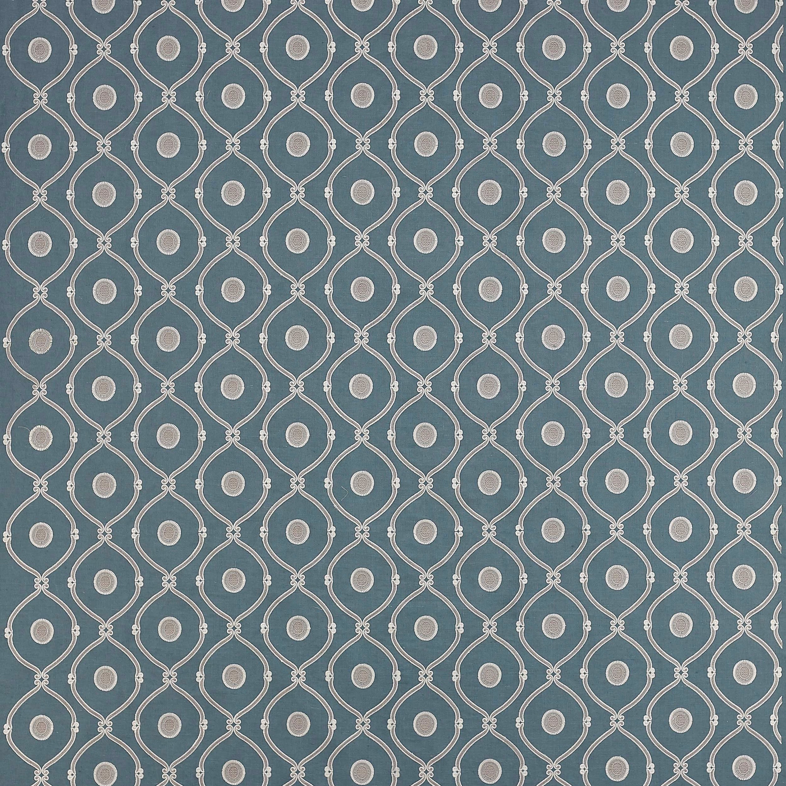 Blue geometric fabric with white outlined teardrop lattice and small dot centres