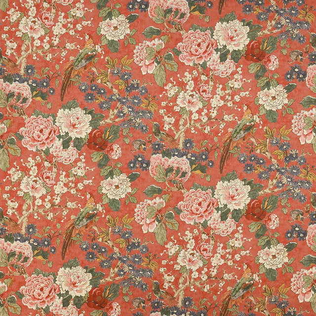 Coral-red floral linen fabric with birds, pink blooms and green foliage