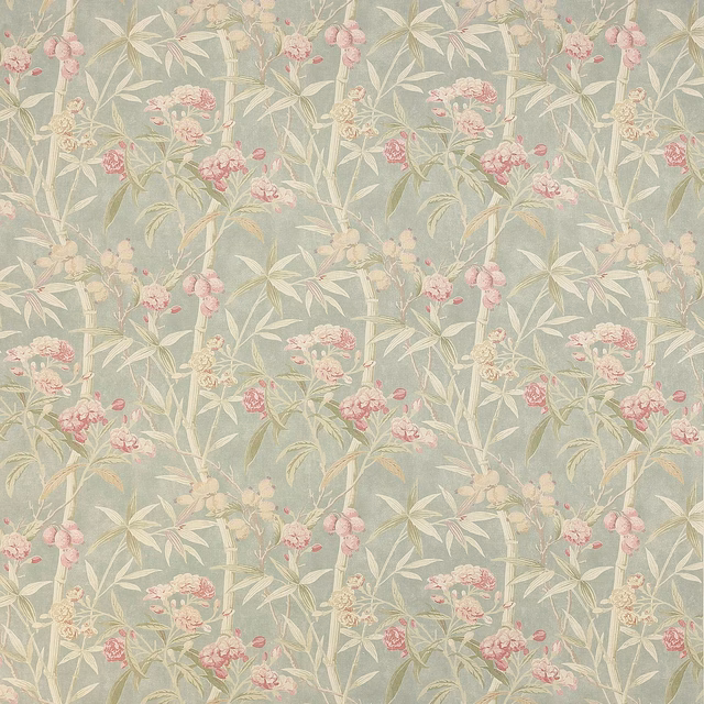 Soft dusty blue linen fabric with pale botanical stems and pink blossom clusters