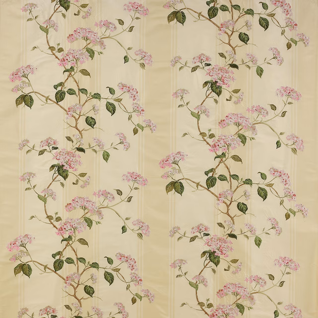 Pale cream floral fabric with pink blossoms and green leafy branches