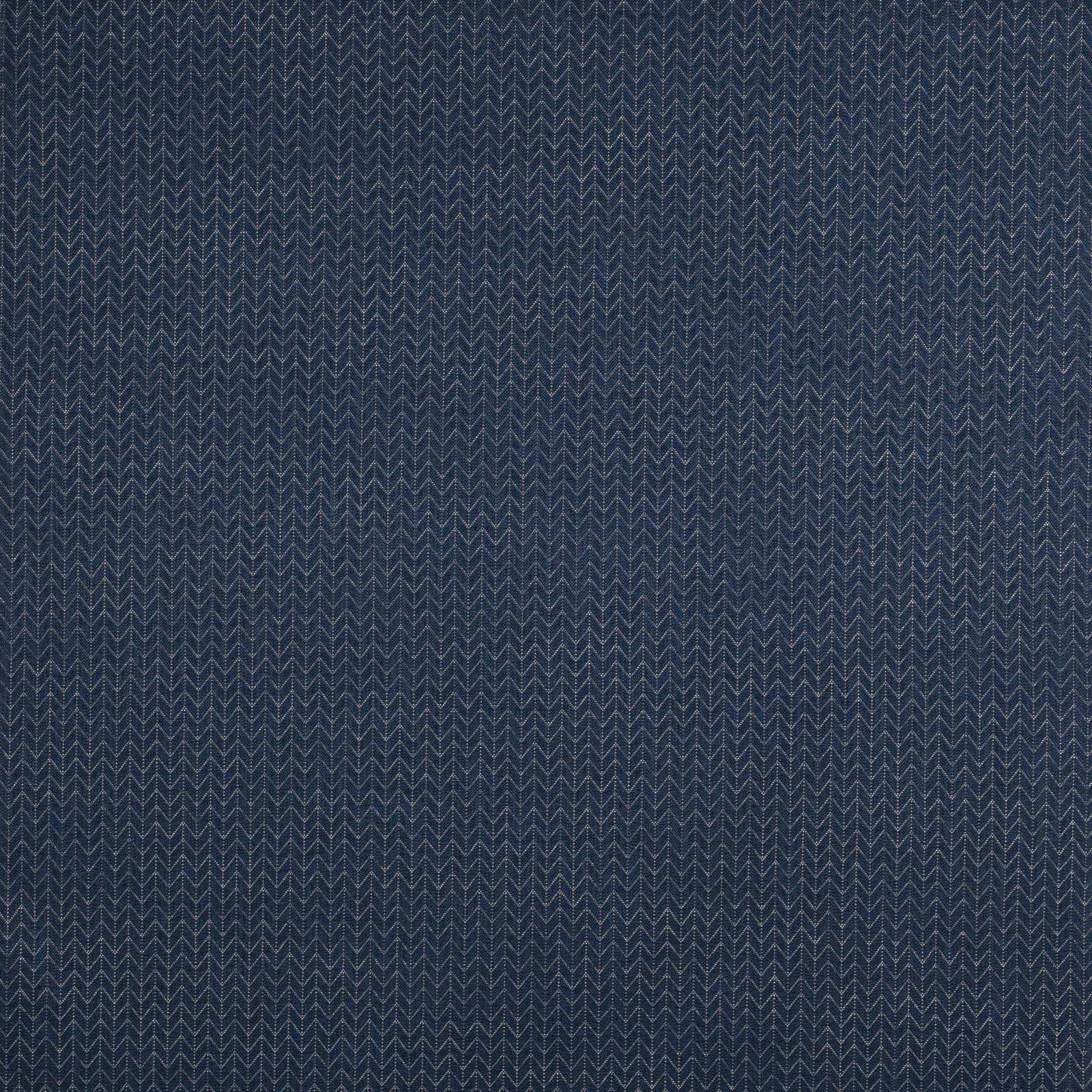 Close-up of deep blue woven geometric fabric with small zigzag rhombus pattern