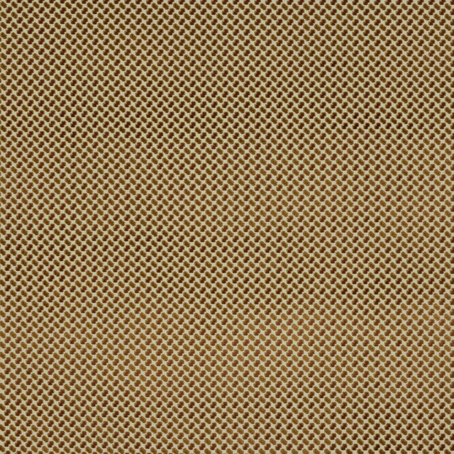 Close-up of a small-scale terracotta and gold woven fabric with tiny repeating diamond-like texture.