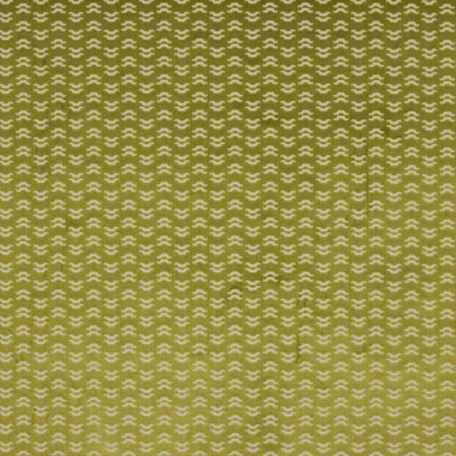 Mustard gold woven fabric with tiny cream abstract motifs in a tight repeat