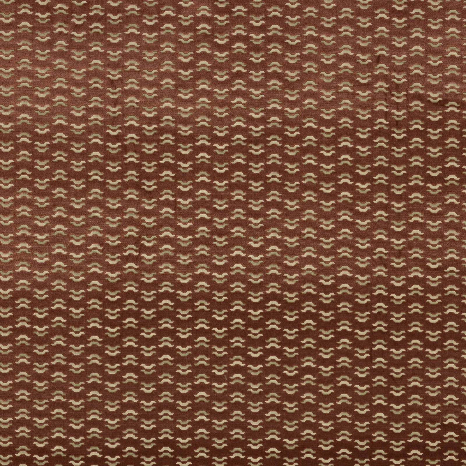 Rose-red patterned fabric swatch with tiny cream geometric repeat