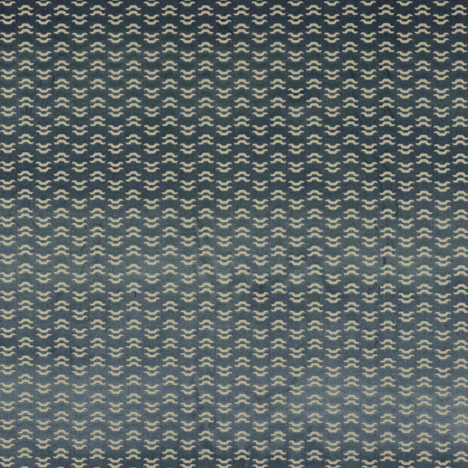 Close-up of Tino Ciel fabric with small cream geometric motif on teal blue ground