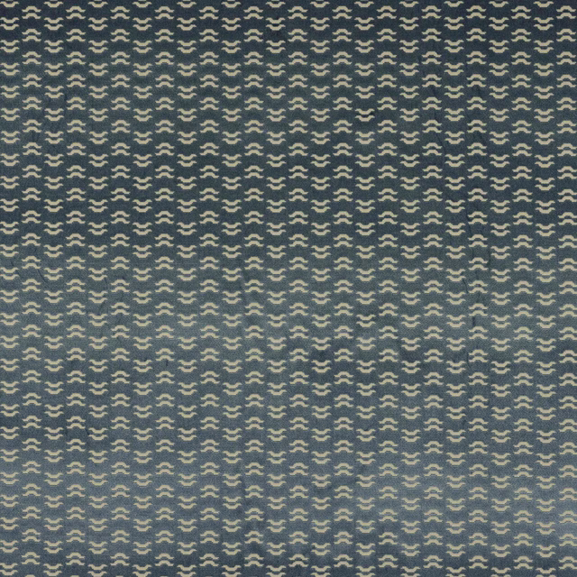 Close-up of Tino Ciel fabric with small cream geometric motif on teal blue ground