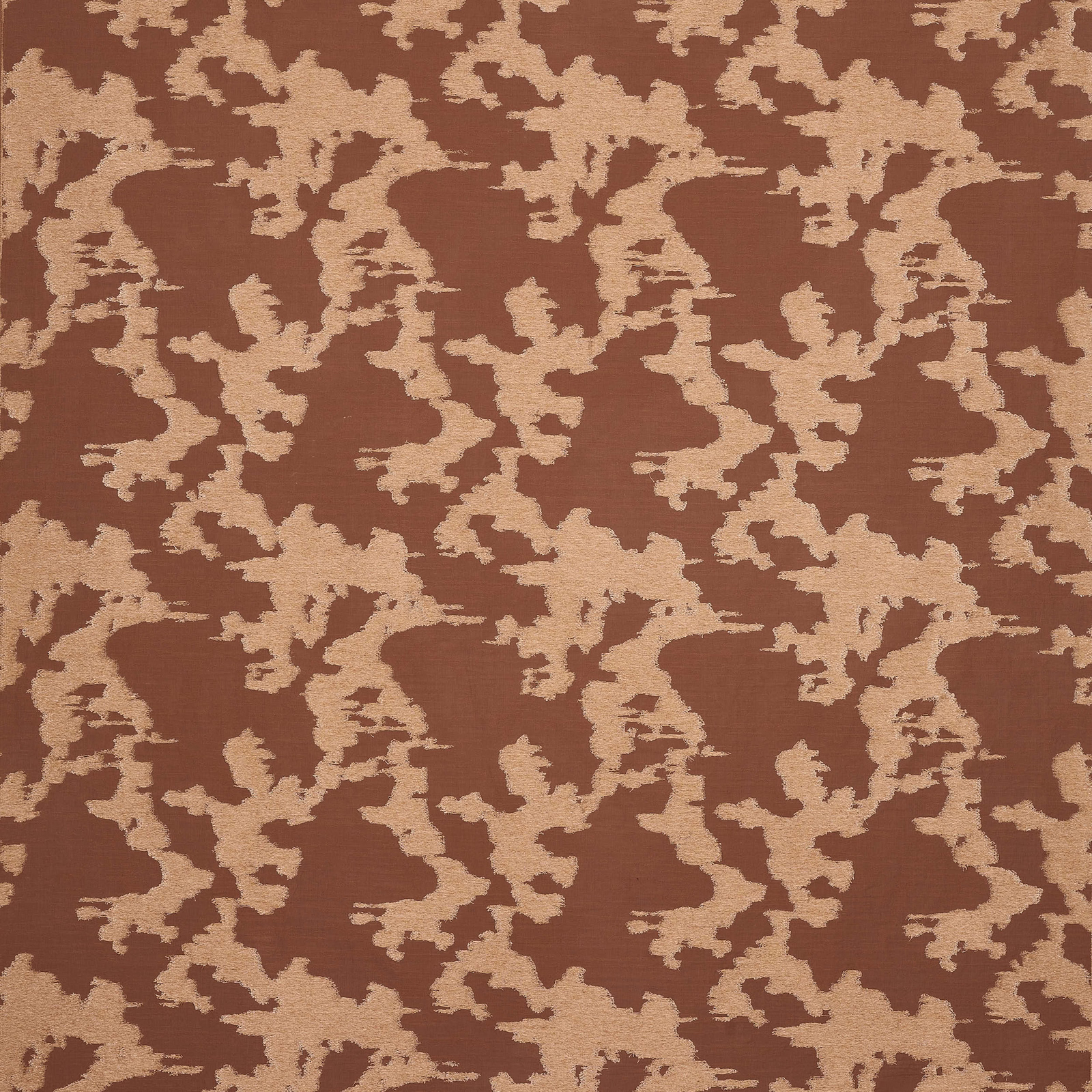 Terracotta geometric upholstery fabric with a cream broken motif and woven texture
