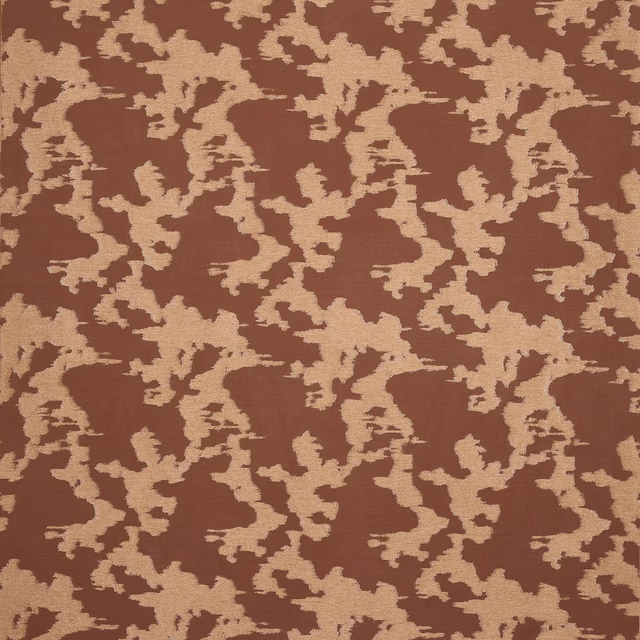 Terracotta geometric upholstery fabric with a cream broken motif and woven texture