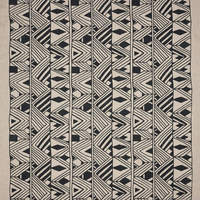 Black geometric stripe and diamond fabric swatch on a pale linen ground