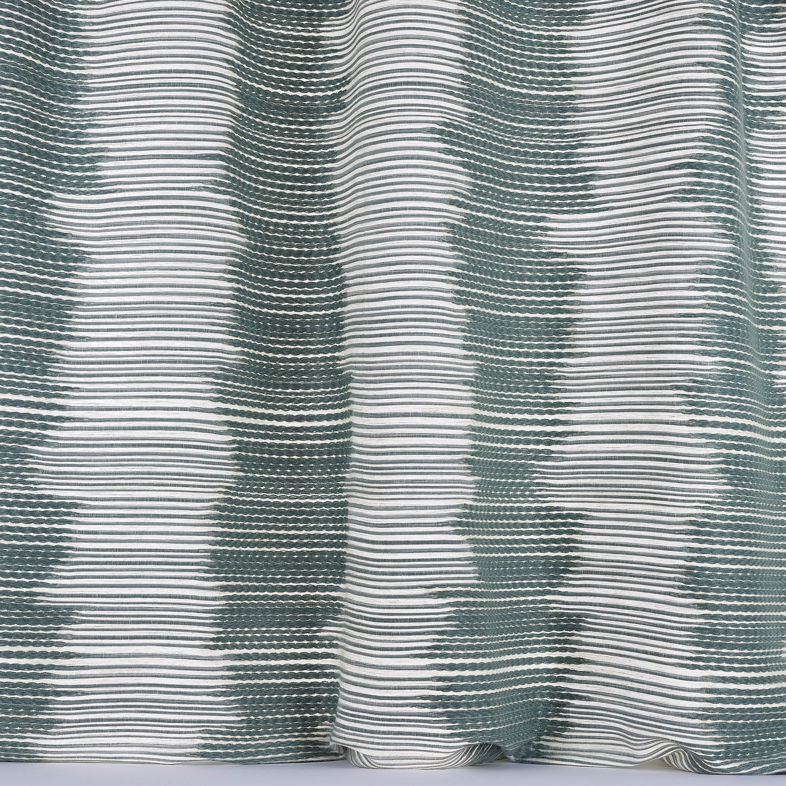 Rippled sea blue and white striped woven fabric with a soft textured surface