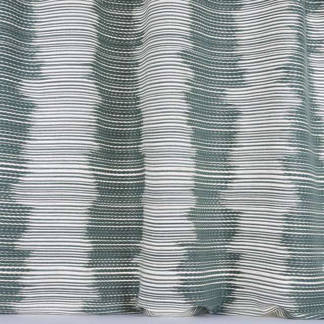 Rippled sea blue and white striped woven fabric with a soft textured surface