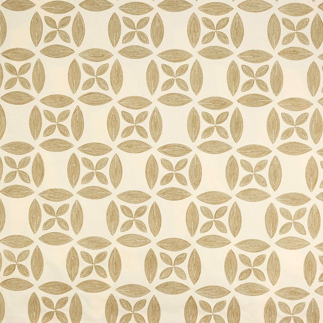 Cream fabric swatch with repeating honey-gold leaf and flower motif