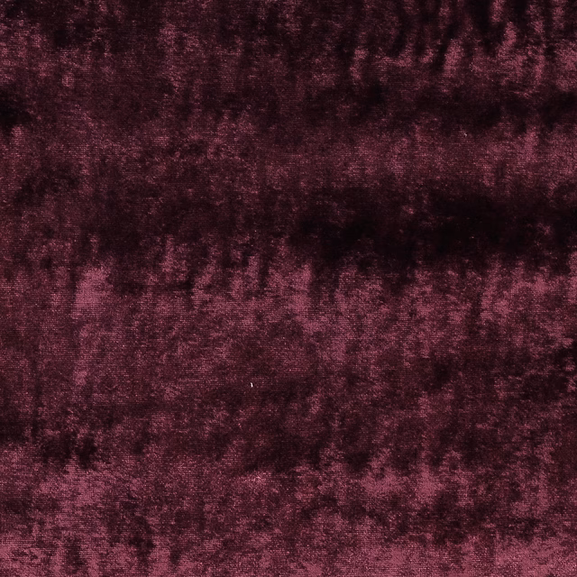 Dark aubergine plum fabric with a soft mottled, velvety texture