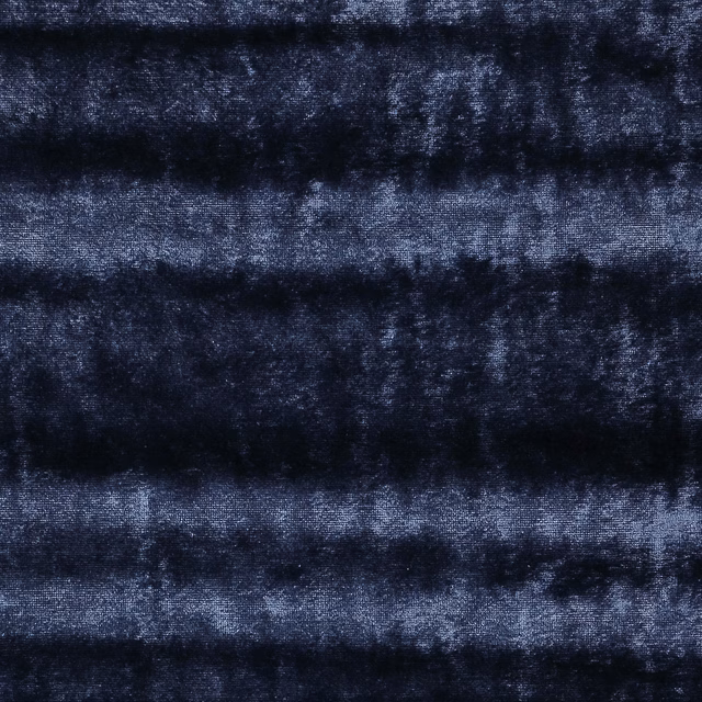 Close-up of deep blue striped fabric with a soft lustrous surface