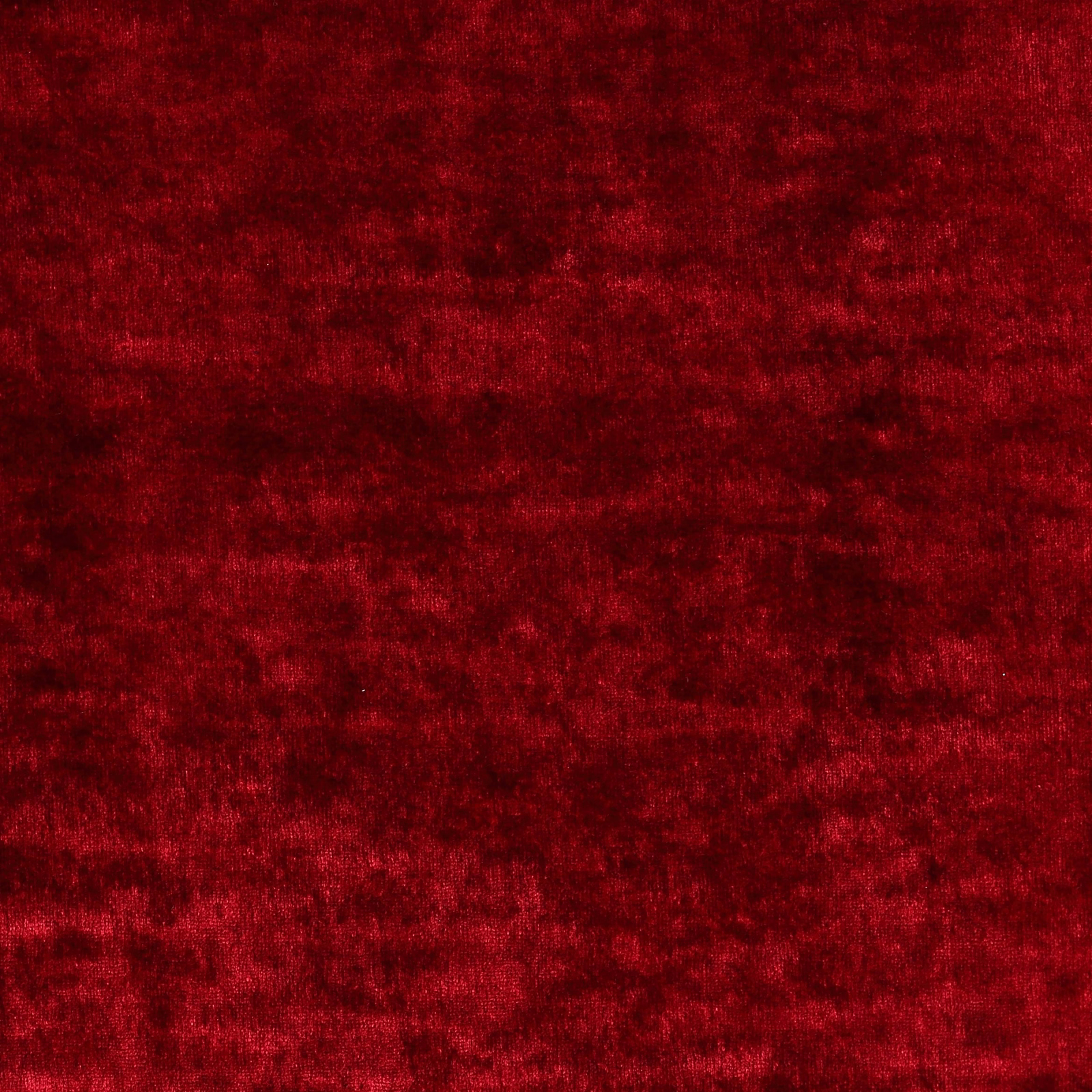 Deep ruby red crushed velvet-style fabric with a soft, tonal pile