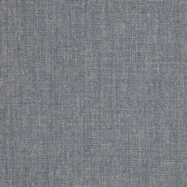 Close-up of a soft slate blue woven fabric with fine speckled texture