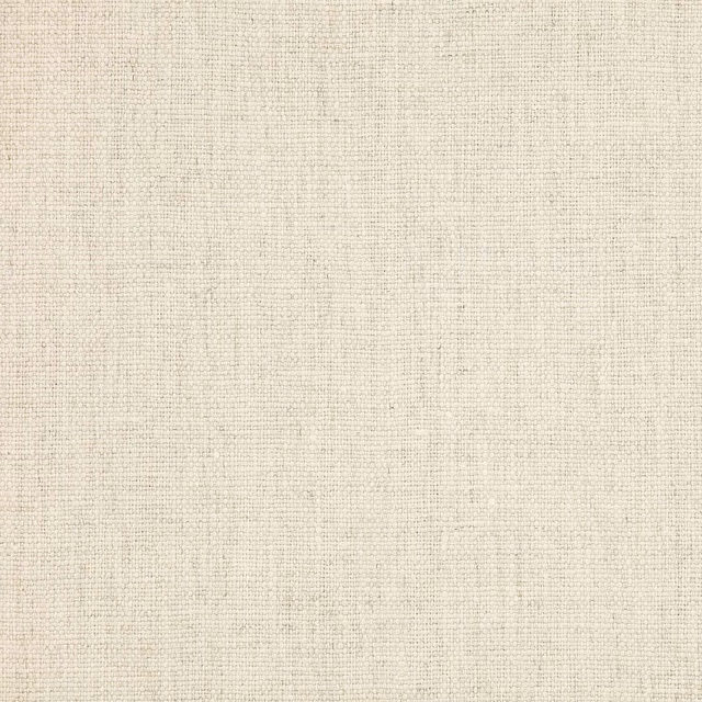 Close-up of soft warm ivory woven fabric with fine natural texture